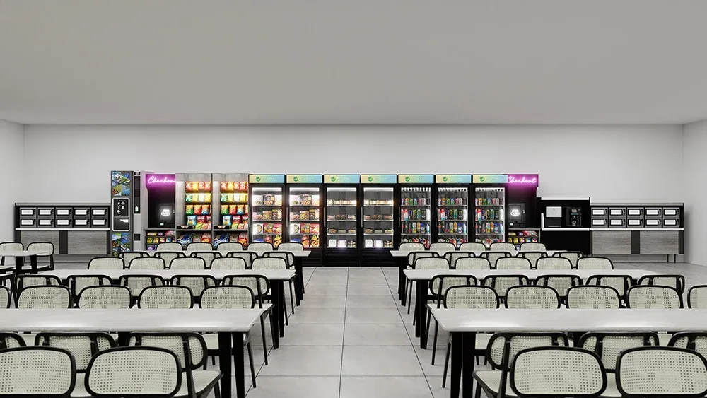 Large employee cafeteria with a full wall of drink coolers, fresh food, and snacks