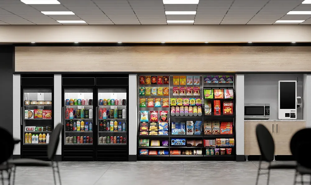 Modern break room micro market with glass-door coolers, a snack wall, and a self-checkout kiosk
