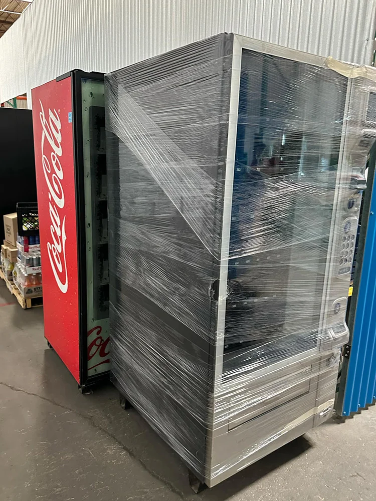 Coca Cola vending machine wrapped in protective film for moving in Dallas Fort Worth