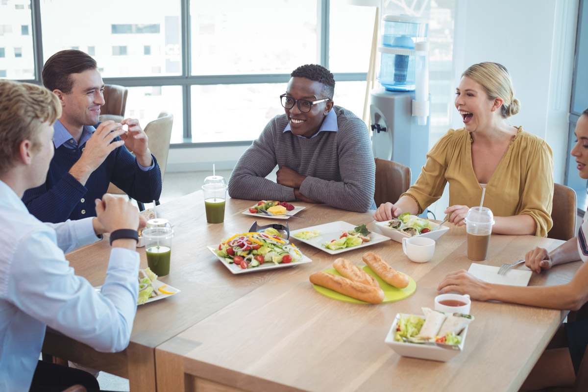 happy office workers during lunch time