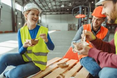 workers in light orange vest