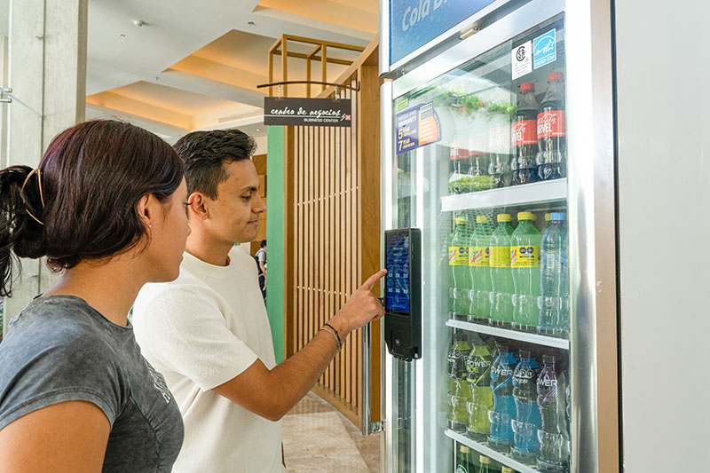 students getting vending snacks