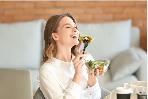 woman lounging while eating