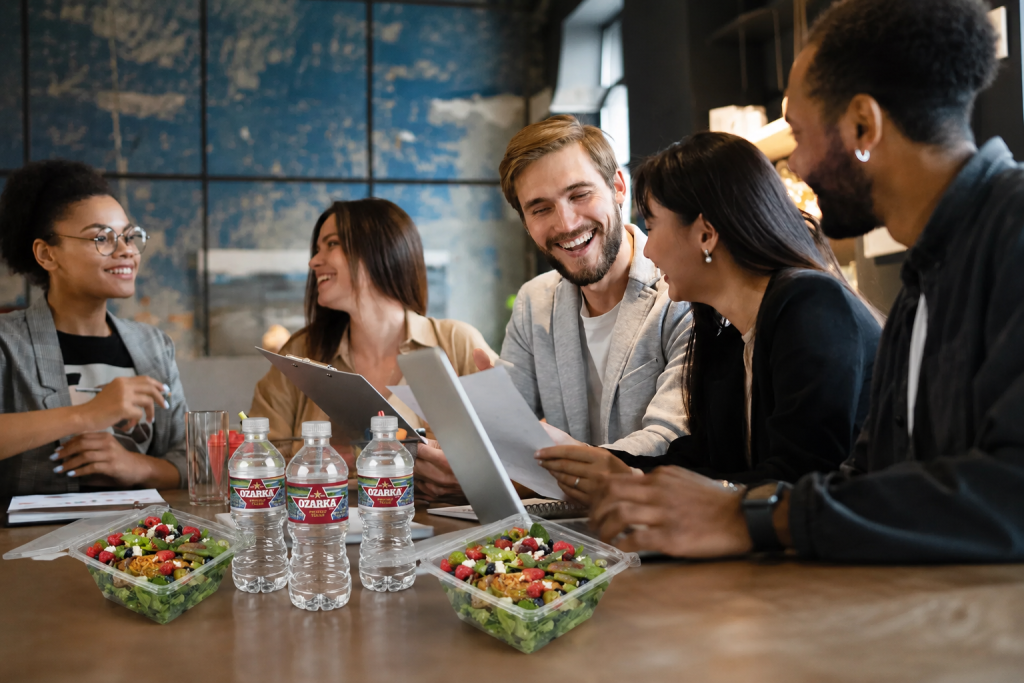 office meeting with salad and water