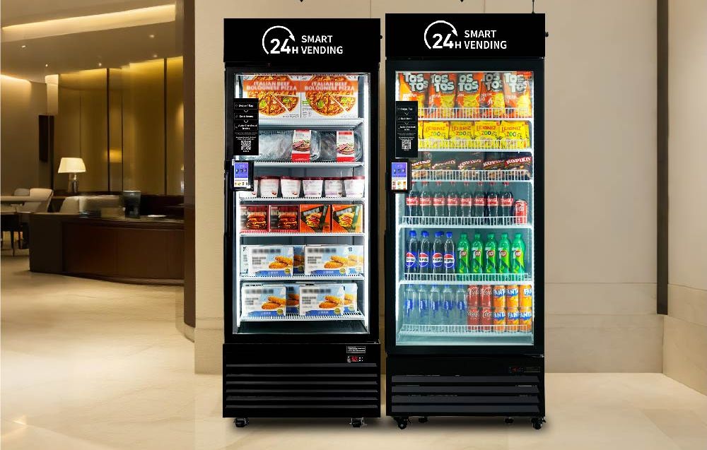 A smart cooler stocked with sandwiches, salads, wraps, bottled drinks, and protein snacks.