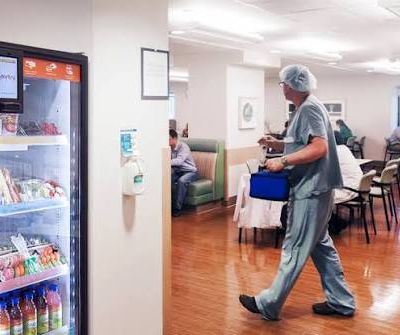 in scrub walking at the vending