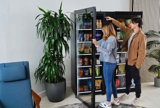 people interacting with a commercial smart cooler or self-service "smart store"
